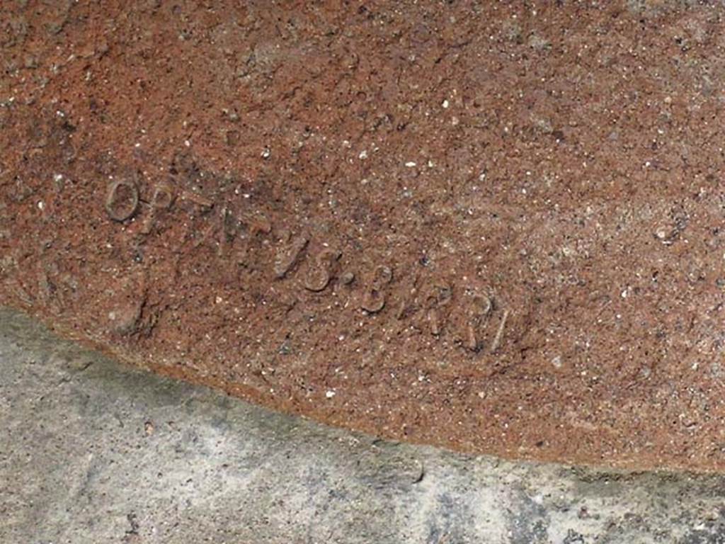 V.17 Herculaneum. May 2004. Embossed wording OPTATVS BIRRI on dolium rim. Photo courtesy of Nicolas Monteix.